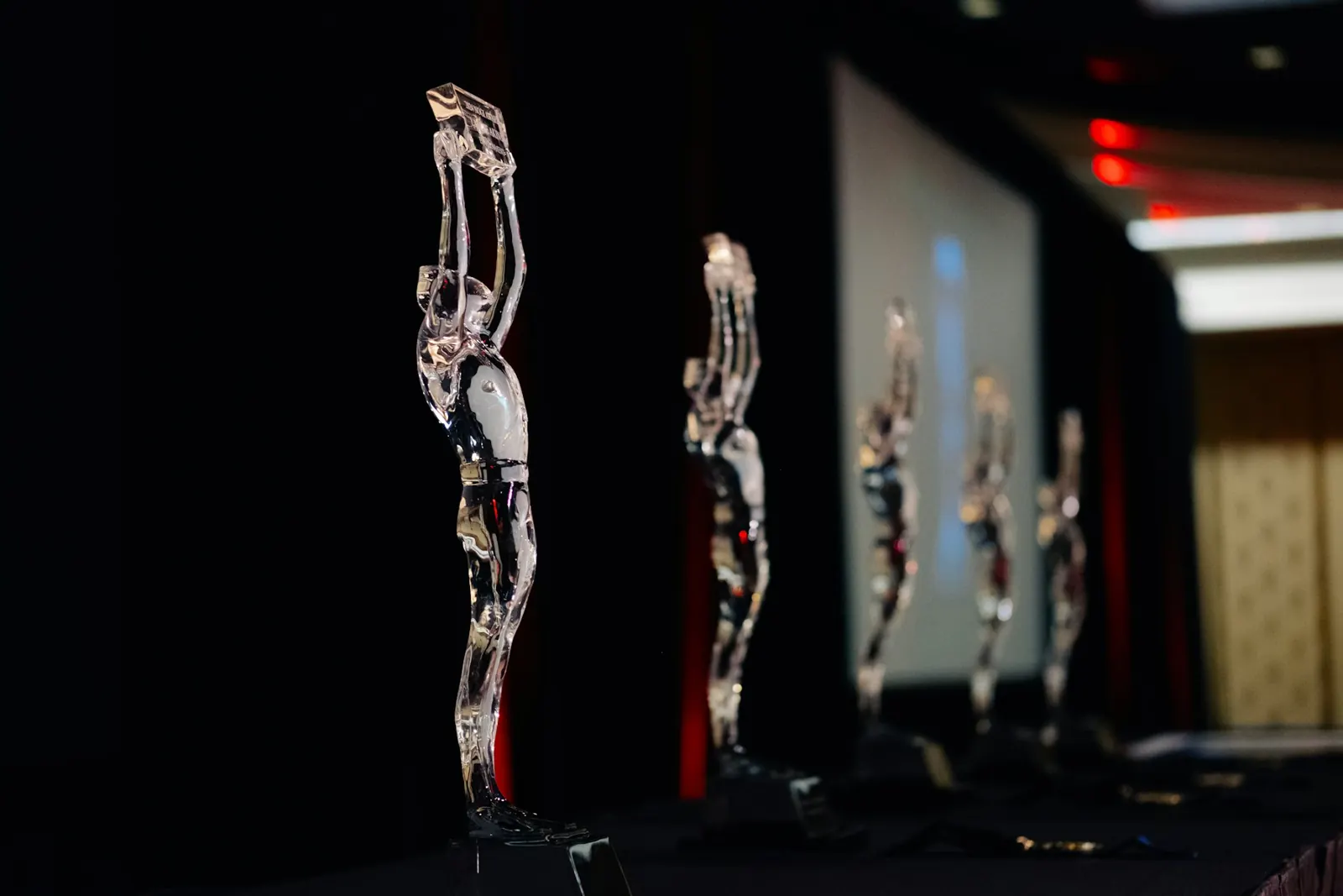 Award trophies on stage at a corporate awards night in Hyderabad