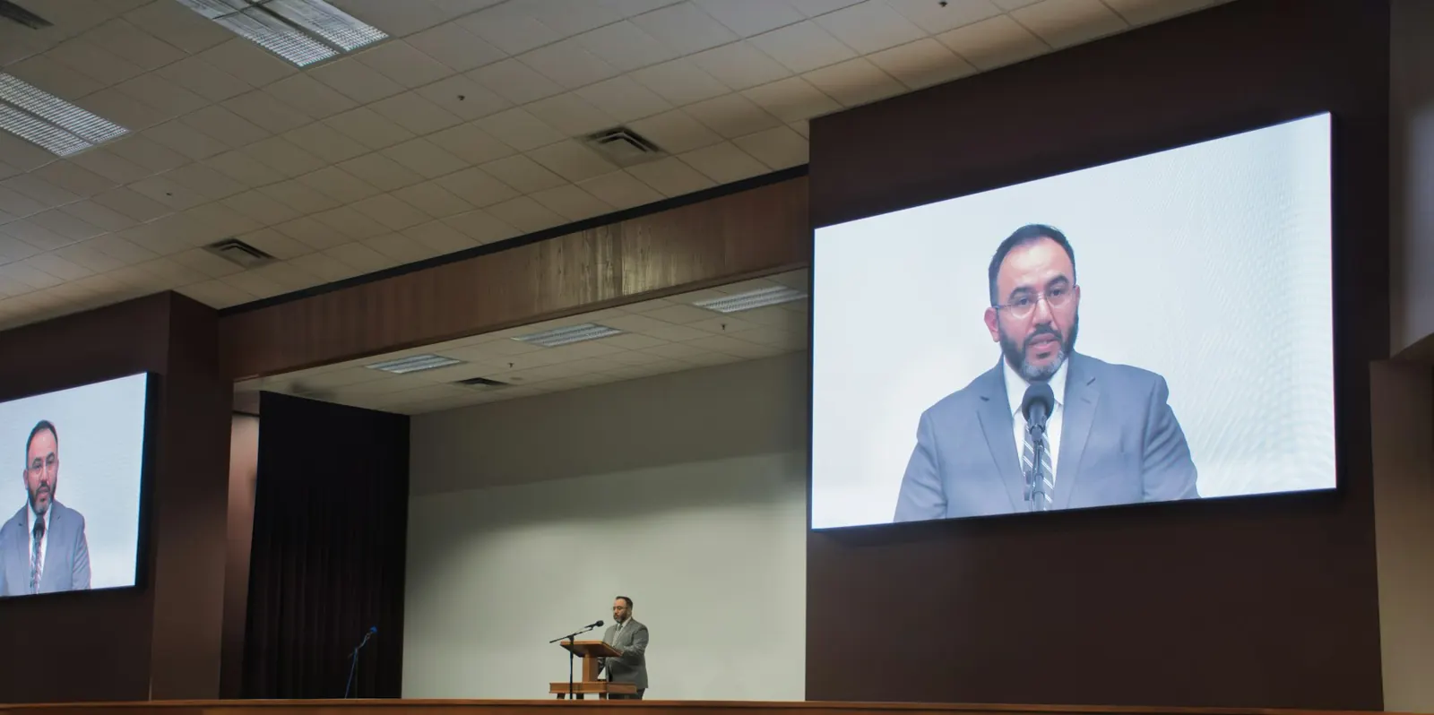 Corporate conference with LED screens and podium